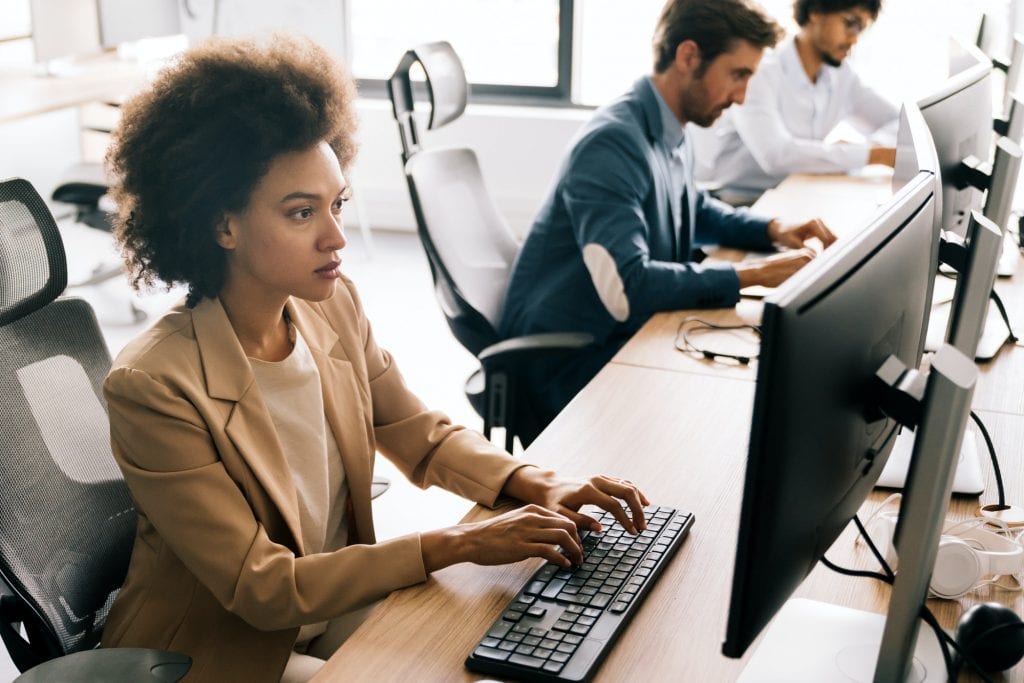 Successful happy woman working at office. Technology, computer, startup, business concept